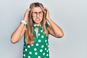 Poster - Beautiful hispanic woman wearing elegant shirt and glasses with hand on head for pain in head because stress. suffering migraine.