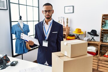 Poster - African american man working as manager at retail boutique depressed and worry for distress, crying angry and afraid. sad expression.