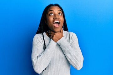 Sticker - African american woman with braided hair wearing casual white sweater shouting and suffocate because painful strangle. health problem. asphyxiate and suicide concept.