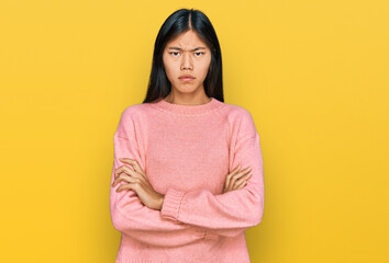 Wall Mural - Beautiful young asian woman wearing casual winter sweater skeptic and nervous, disapproving expression on face with crossed arms. negative person.