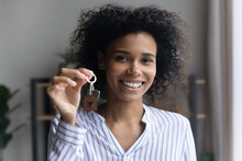 Holding Keys. Excited Biracial Woman First Time Flat Buyer Look At Camera Show Key Of New Dwelling. Portrait Of Friendly Young Black Female Broker Look At Camera Propose Help In Buying Renting Realty