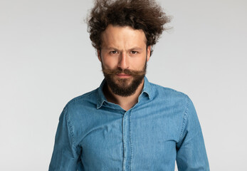 Sticker - casual fashion model with beard making a serious face when frowning