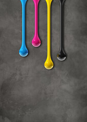 Wall Mural - cmyk ink drops on dark concrete background