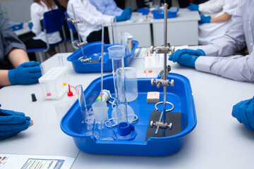 chemical experience close-up. gloved hands. school experiments. chemistry lessons. laboratory