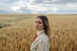 © ADDICTIVE STOCK - Stylish thoughtful model in wheat field under cloudy sky