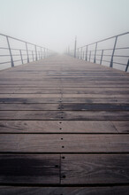 Wooden Pier In Foggy Morning