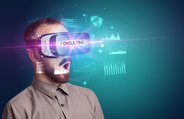 Businessman looking through Virtual Reality glasses