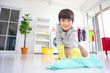 © Akarawut - Asian boy help cleaning the floor for daily routine chores and housekeeping