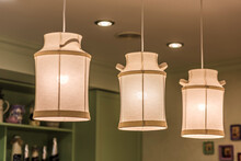 Pendant Lamps Made Of Fabric In Shape Of Milk Cans In Kitchen Interior