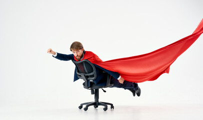 Wall Mural - man with red cloak in office chair manager superhero studio