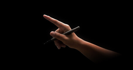 hand holding black pen and drawing or write isolated on dark background with signature concept and e