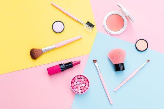 makeup products and decorative cosmetics on color background flat lay. fashion and beauty blogging c