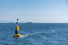 Small Lighthouse At Sea, Yellow Buoy,
