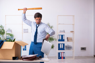 Young male employee in business relocation concept