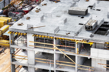 Construction of a monolithic reinforced concrete house. Modern building technologies. Construction of a modern multi-storey building.