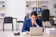 © Elnur - Young male employee and too much work in the office