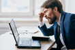 © SHOTPRIME STUDIO - businessmen in the office at the desk in front of a laptop career professional