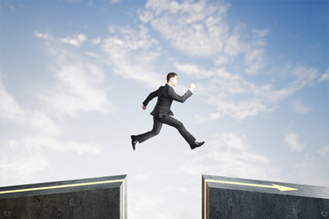 Poster - Side view of businessman jumping over gap on sky background with mock up lace. Challenge and success concept.