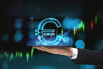 Poster - Close up of hand holding tablet computer with creative glowing polygonal euro city hologram on blurry bokeh background. Cryptocurrency, online banking, price and trade concept.