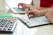 © RomanR - Human hands with 1040 tax form closeup