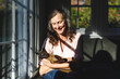 © WavebreakMediaMicro - Happy senior caucasian woman in bedroom, holding her pet cat