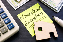 Homestead Exemption Written On The Sticker And Model Of Home.