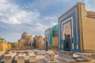 Wall Mural - Panorama of the mausoleums of the Shakhi-Zinda complex. In the foreground are medieval gravestones. Shot in Samarkand, Uzbekistan