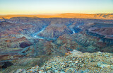 Fototapeta Do pokoju - landscape with Fish River Canyon in south Namibia: view into the canyon at sunrise
