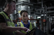 © ReeldealHD images - Male engineer training a female engineer in an industrial plant room