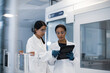 © ReeldealHD images - Female scientists discussing results of experiment