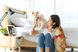 © bigy9950 - Young Asian woman relaxing and playing with three dogs (brown shiba inu, white shiba puppy and white maltese)in bedroom at home, Cheerful and nice couple with people and pet. Pet Lover concept