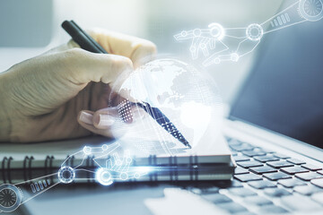 Aufkleber - Creative abstract robotics technology hologram with globe and hand writing in diary on background with laptop, artificial intelligence and machine learning concept. Multi exposure