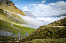 Klausen Pass Through The Low Clouds Over Swiss Alps, Switzerland