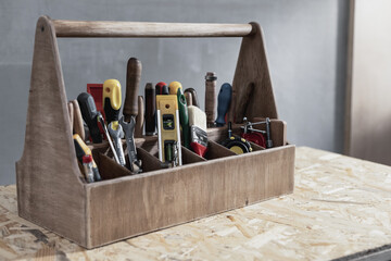 Construction tools and toolbox on wooden table background texture. Tool box kit