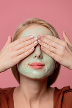 Beautiful Blond Girl With Green Mask On Her Face