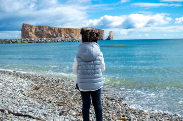 Wall Mural - Girl enjoying Perce Rock view from Gaspe in Quebec - Le Rocher Percé / Gaspésie,Québec,Canada