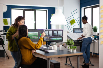Poster - coworkers talking about movie project looking at film footage working in creative start up agency of