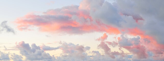 clear blue sky, red, pink, golden cirrus and cumulus clouds after storm. dramatic sunset cloudscape.