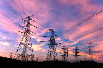 Wall Mural - A silhouette of an electric tower against a beautiful sunset background