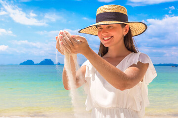 Wall Mural - Sand falling through woman hands