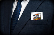 A Poker King Card In The Pocket Of A Suit.