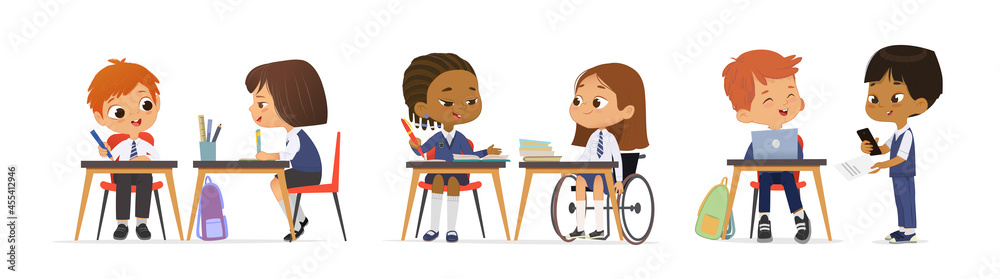 Cheerful diverse kids in school uniform talking sitting tables enjoying ...