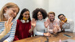 © MandriaPix - multiethnic group of millennials in video conference, wearing facemasks for coronavirus epidemic, team of students engaged in an online call, the new normal, diversity and aggregation