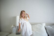 © Aleksandra Iarosh - little cute girl jumping on the bed in the bedroom