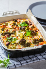 Canvas Print - Quiche pie with salmon and broccoli in baking dish.