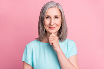 Wall Mural - Photo of think aged grey hairdo lady hand chin wear blue blouse isolated on pink color background