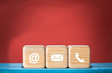 Canvas Print - contact us icon (phone, email, mail ) on the wood cube, customer service and support concept