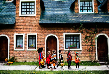 Wall Mural - Young kids trick or treating during Halloween