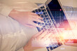 © peshkova - Double exposure of woman hands working on computer and data theme hologram drawing. Top View. Technology concept.