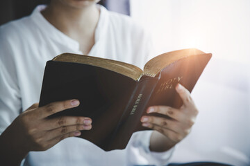 Wall Mural - Girl reading from the holy bible